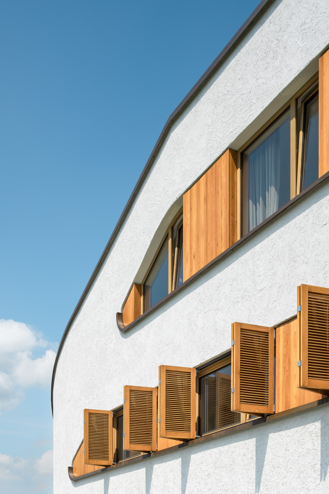 Geräumiges Modernes Haus mit Putzfassade, weißer Fassadenfarbe und Pultdach in Sonstige