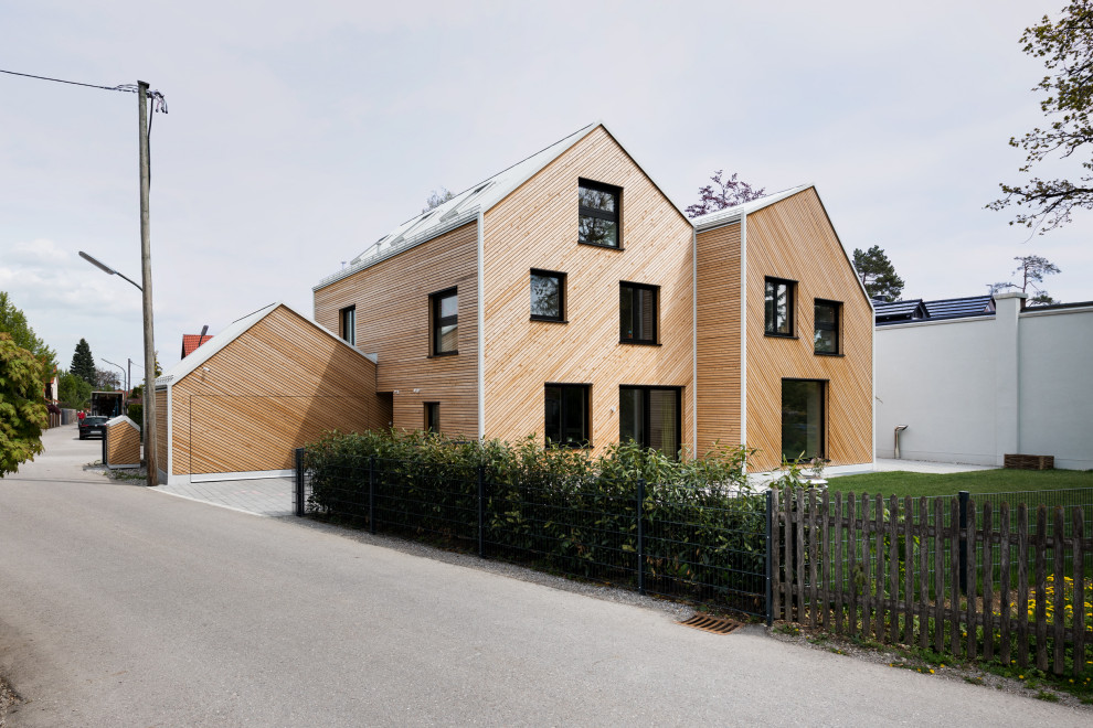 Inspiration for a wood duplex exterior remodel in Munich
