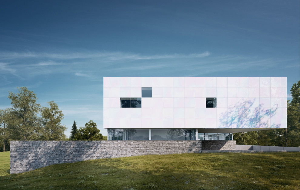 Foto della facciata di una casa grande bianca moderna a tre piani con tetto piano
