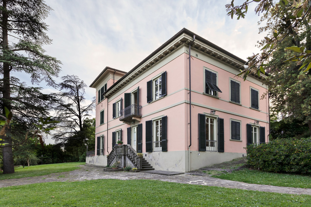 Inspiration for a timeless pink exterior home remodel in Florence
