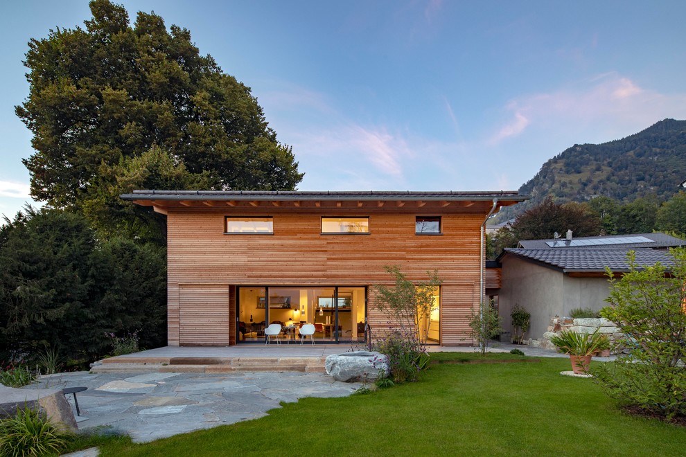 Inspiration for a mid-sized contemporary brown two-story wood exterior home remodel in Munich