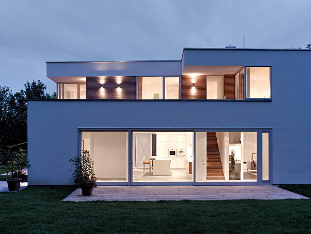 Large and white modern two floor house exterior in Stuttgart with a flat roof.
