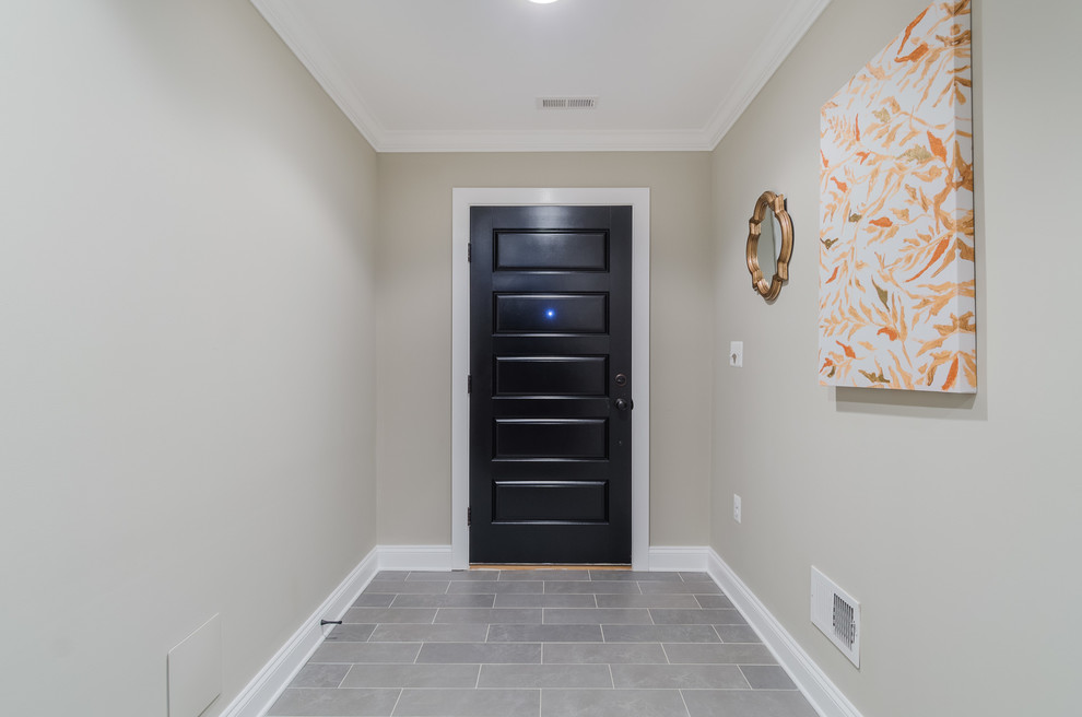 Large urban slate floor and gray floor hallway photo in Baltimore with beige walls