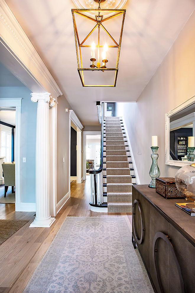 Inspiration for a mid-sized timeless painted wood floor hallway remodel in Richmond with gray walls