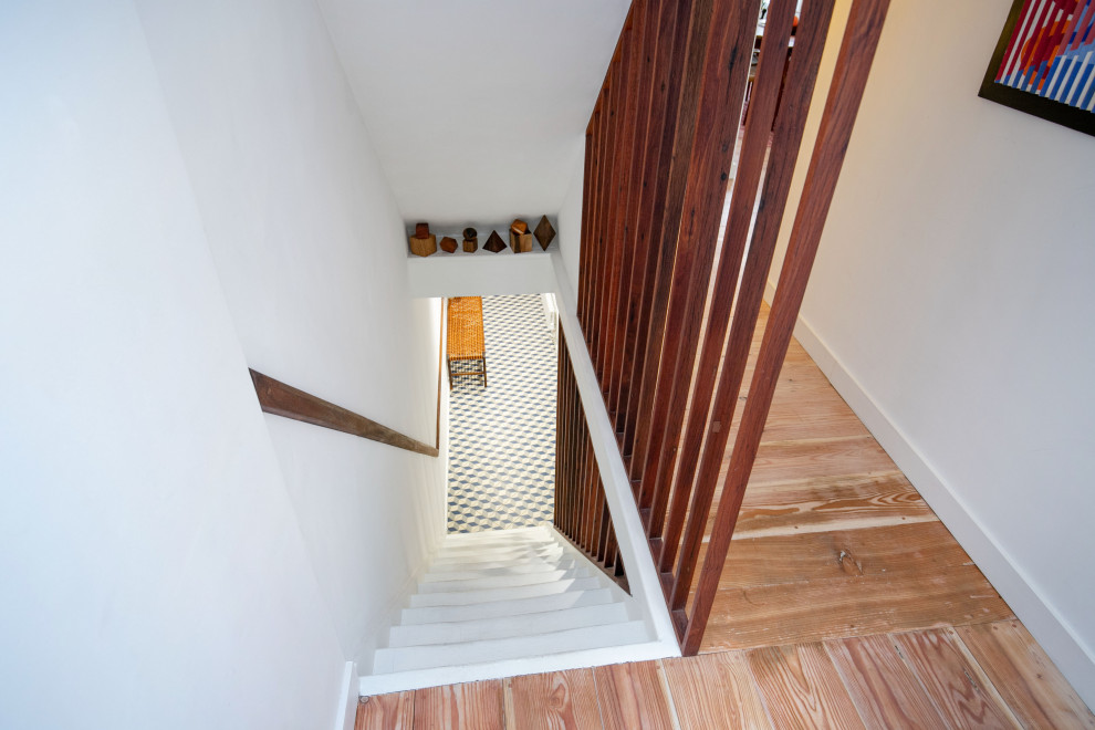 Medium sized modern staircase in Sussex with brick walls.