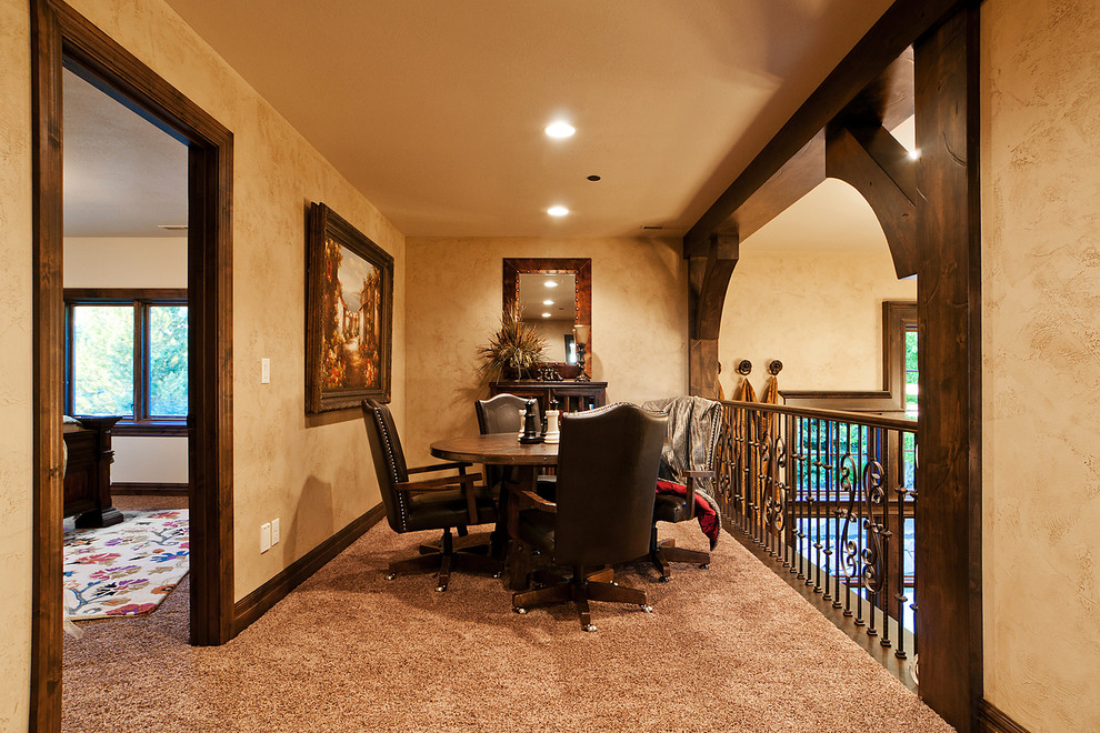 Example of a mid-sized mountain style carpeted hallway design in Salt Lake City with beige walls