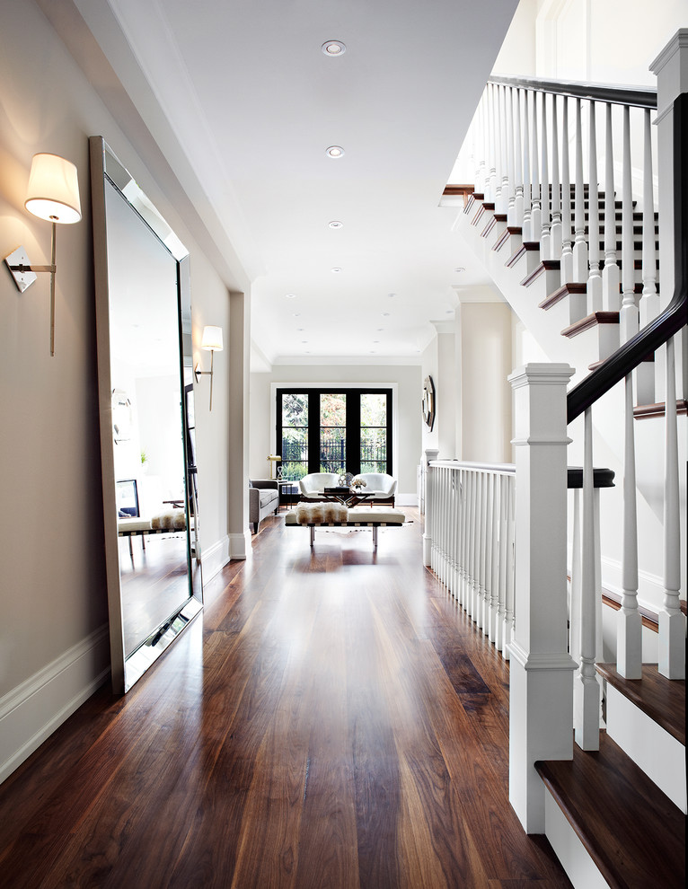 Inspiration for a transitional dark wood floor and brown floor hallway remodel in Dallas with beige walls