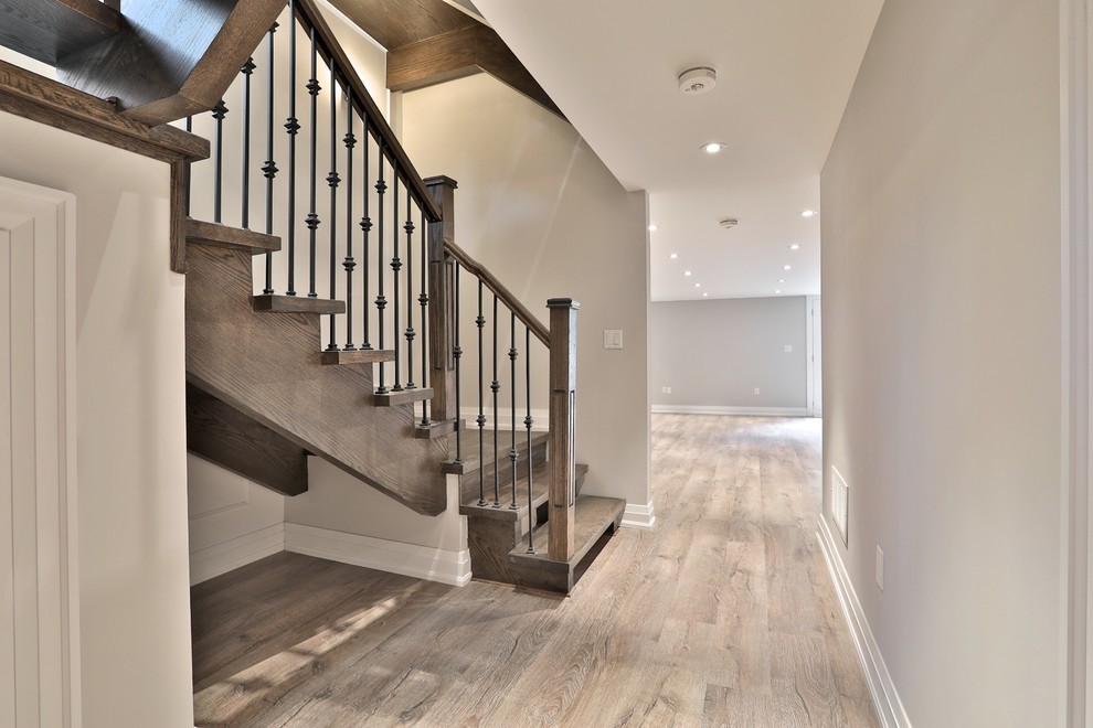 Hallway - mid-sized contemporary medium tone wood floor and beige floor hallway idea in Toronto with beige walls