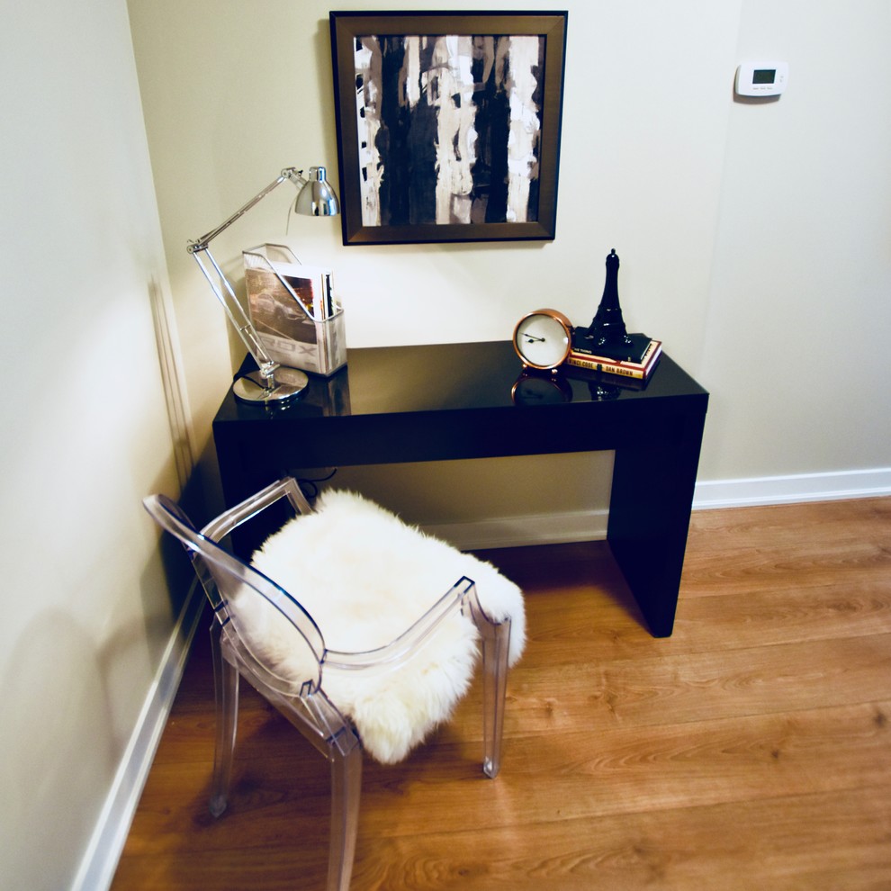 Inspiration for a mid-sized transitional light wood floor and brown floor hallway remodel in Toronto with gray walls
