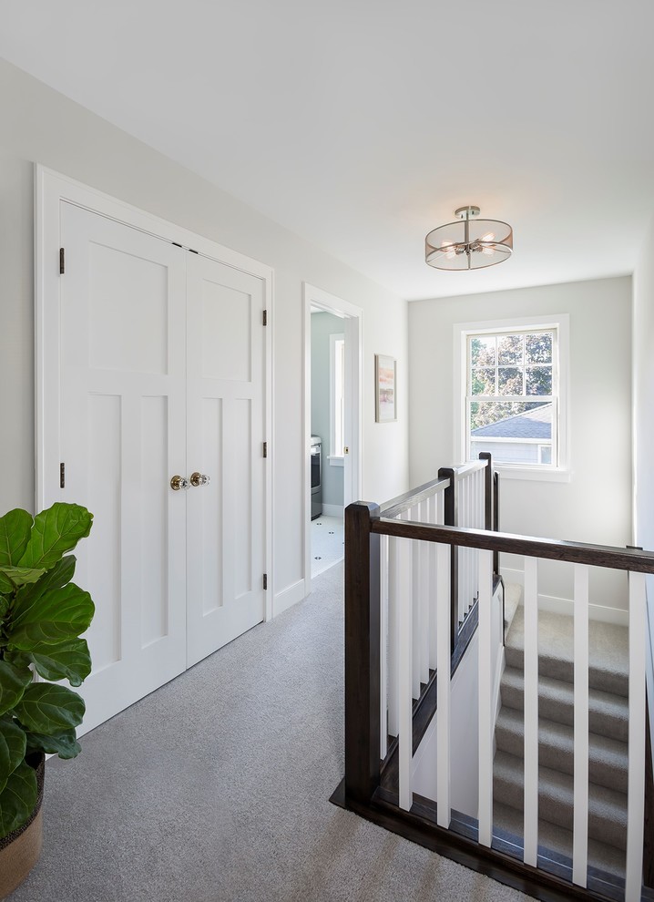 Example of a transitional carpeted and gray floor hallway design in Minneapolis with white walls