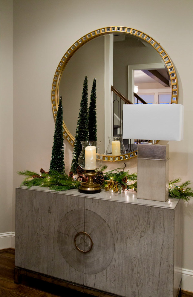 Example of a mid-sized transitional dark wood floor and brown floor hallway design in Kansas City with beige walls