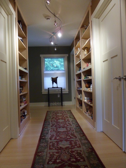 Example of a classic bamboo floor hallway design in Grand Rapids with green walls