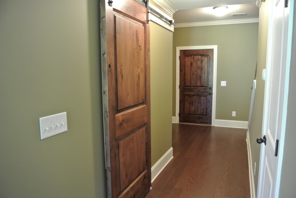 Example of a mid-sized transitional dark wood floor hallway design in Atlanta with gray walls