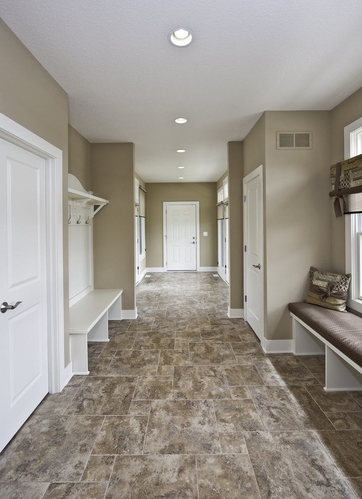 Large arts and crafts slate floor hallway photo in Grand Rapids with beige walls