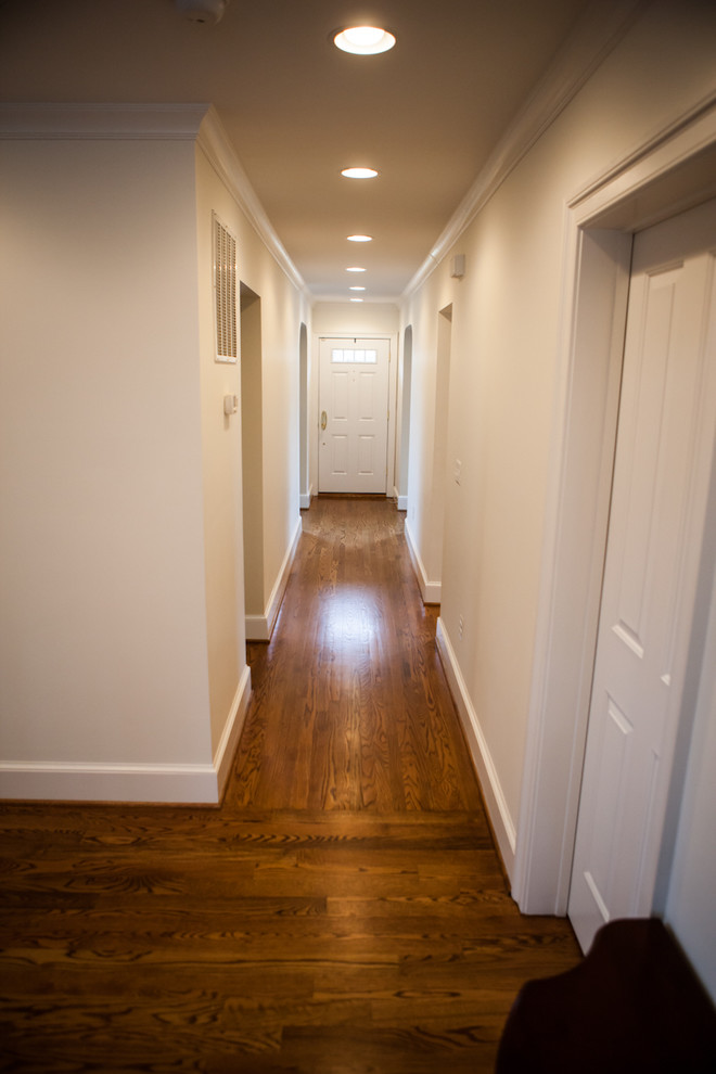 Hallway - mid-sized cottage dark wood floor hallway idea in DC Metro with beige walls