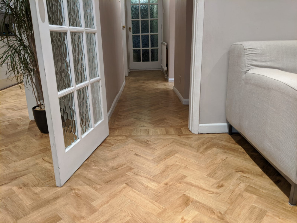 Mid-sized transitional vinyl floor and brown floor hallway photo in Hertfordshire with gray walls
