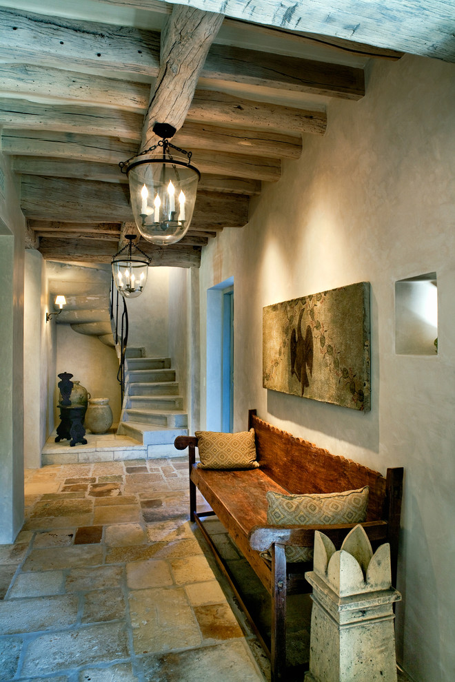 Hallway - traditional slate floor hallway idea in Phoenix with beige walls