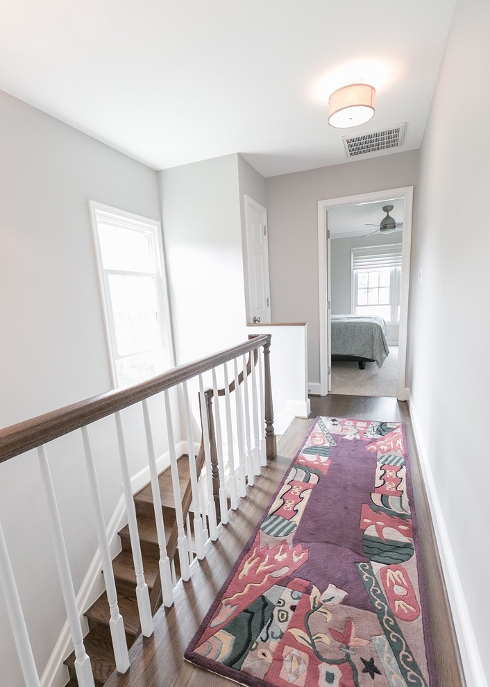 Inspiration for a small transitional dark wood floor hallway remodel in DC Metro with gray walls