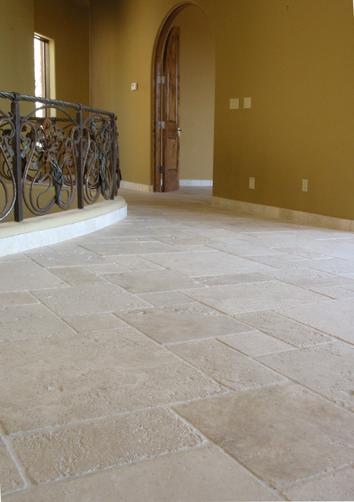 Inspiration for a large mediterranean travertine floor hallway remodel in Phoenix with yellow walls