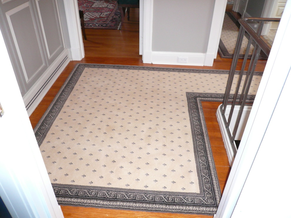 Inspiration for a mid-sized timeless light wood floor hallway remodel in Ottawa with gray walls