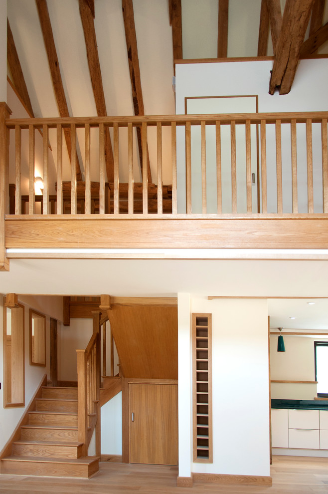 Hallway - large transitional medium tone wood floor hallway idea in Surrey