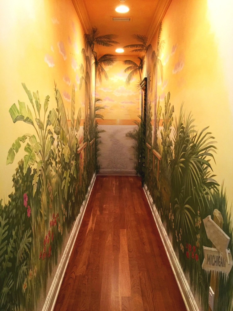 Inspiration for a tropical medium tone wood floor hallway remodel in Miami with multicolored walls