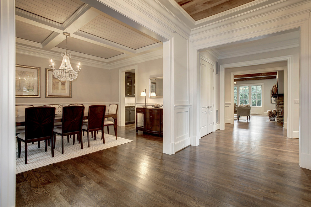 Large arts and crafts medium tone wood floor hallway photo in DC Metro with white walls