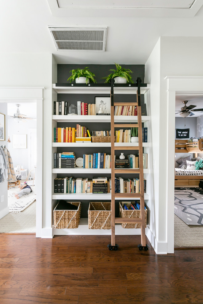 Hallway - medium tone wood floor and brown floor hallway idea in Charleston with white walls