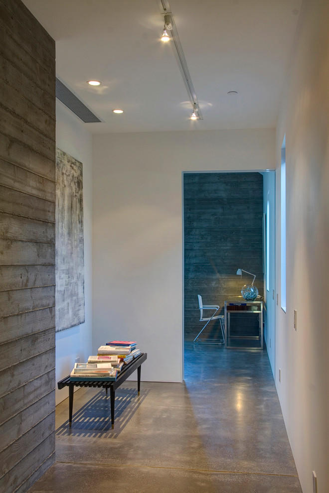 Inspiration for a farmhouse concrete floor hallway remodel in San Francisco with white walls