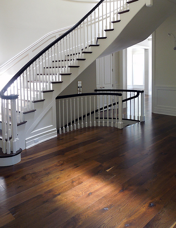 Inspiration for a large contemporary wooden curved wood railing staircase remodel in Chicago with wooden risers