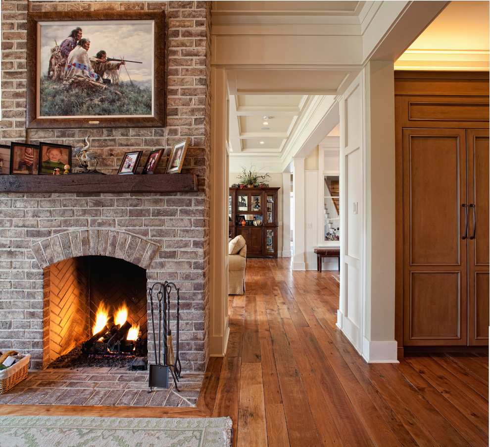 Inspiration for a mid-sized timeless medium tone wood floor hallway remodel in Charleston with white walls
