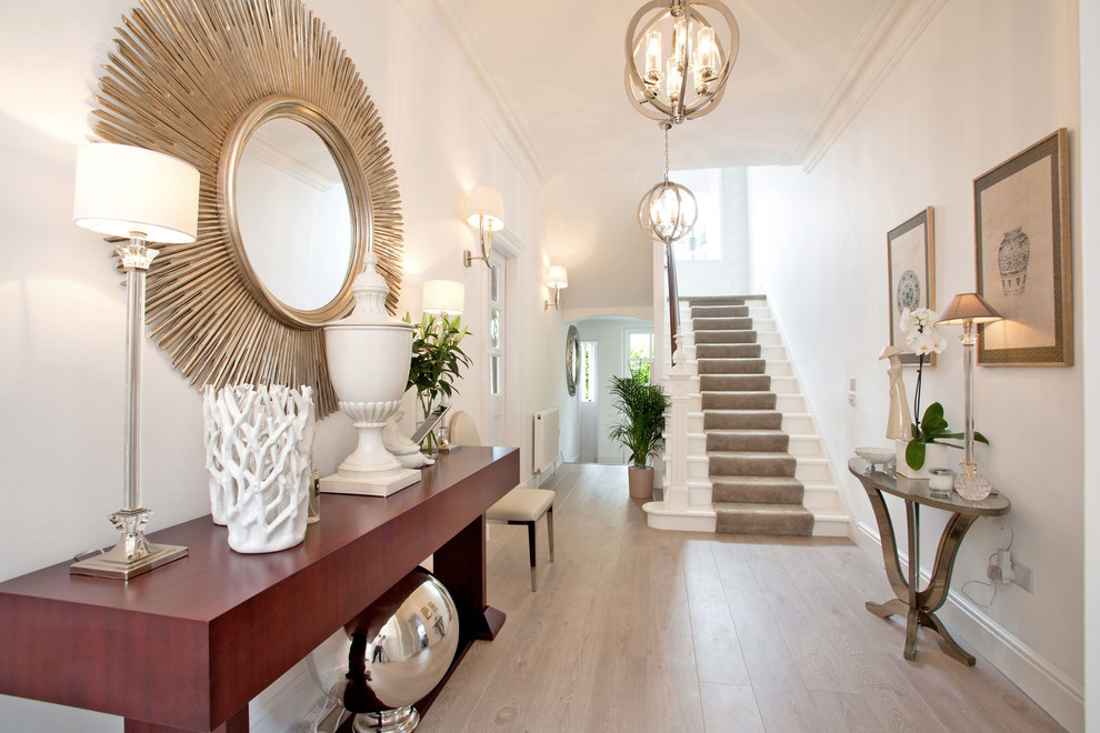 Inspiration for a transitional medium tone wood floor hallway remodel in Other with white walls