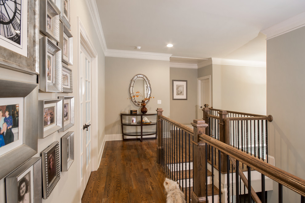 Inspiration for a mid-sized timeless medium tone wood floor hallway remodel in Atlanta with gray walls