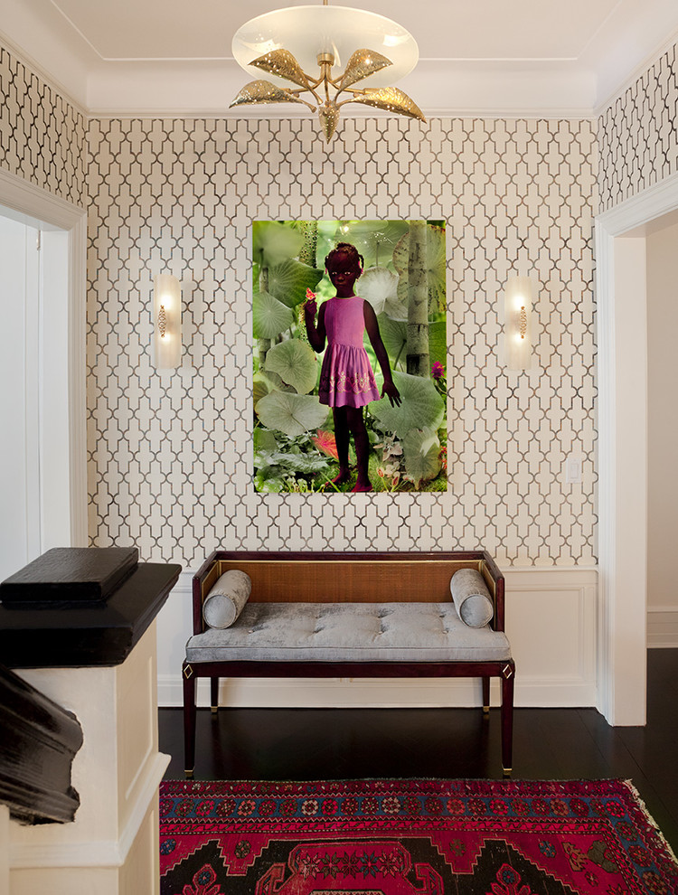 Inspiration for a mid-sized transitional dark wood floor hallway remodel in New York with multicolored walls