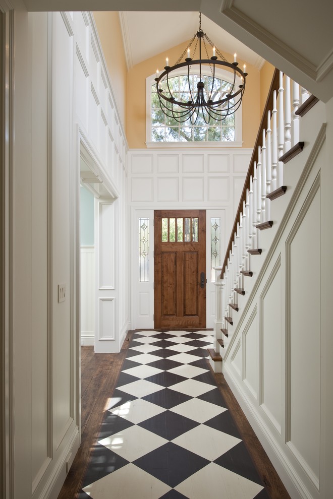 Example of a classic dark wood floor and multicolored floor hallway design in San Francisco with white walls