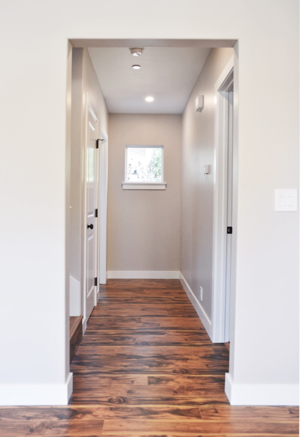 Mid-sized arts and crafts laminate floor and brown floor hallway photo in San Luis Obispo with gray walls