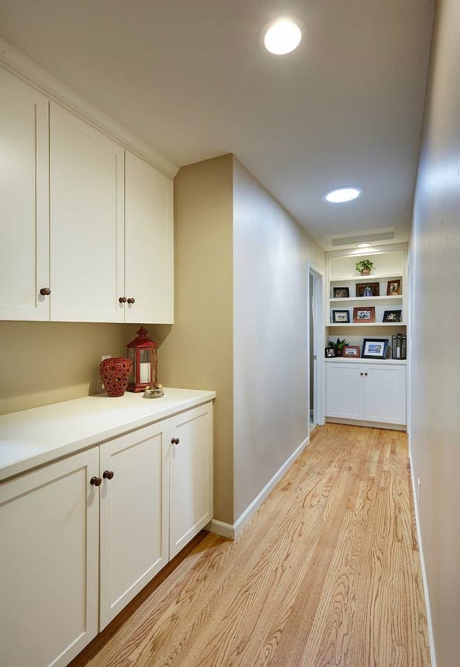 Small minimalist light wood floor hallway photo in Sacramento with beige walls