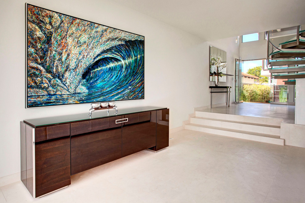 Example of a trendy white floor hallway design in Orange County with white walls