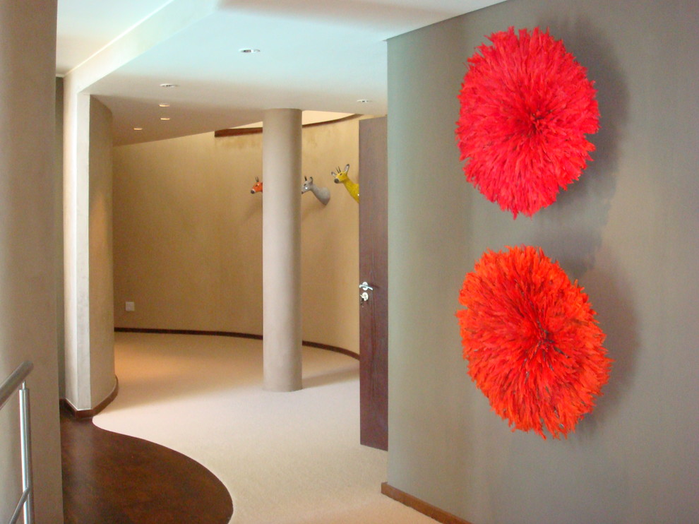 Inspiration for a contemporary hallway remodel in Other with gray walls