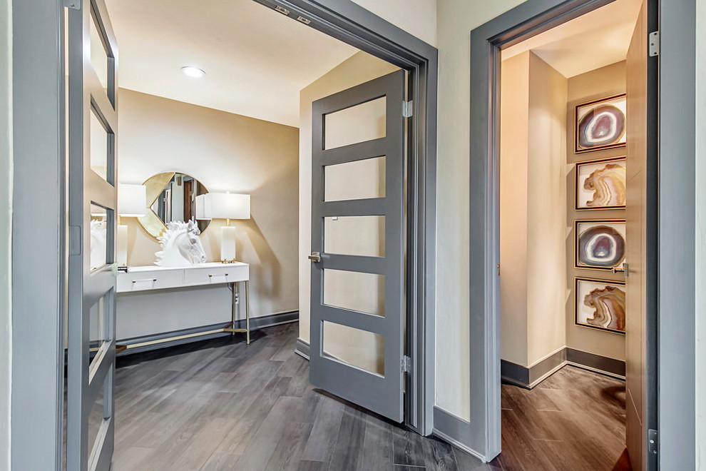 Example of a mid-sized trendy dark wood floor and gray floor hallway design in Oklahoma City with gray walls