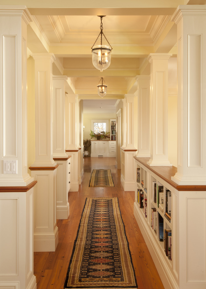 Ornate medium tone wood floor hallway photo in Boston