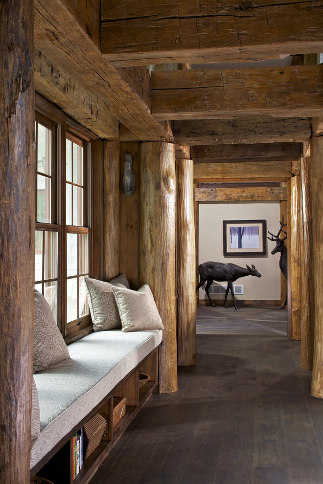 Example of a mountain style dark wood floor and brown floor hallway design in Other