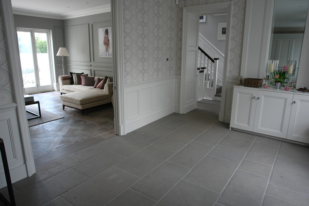 Inspiration for a transitional limestone floor hallway remodel in London