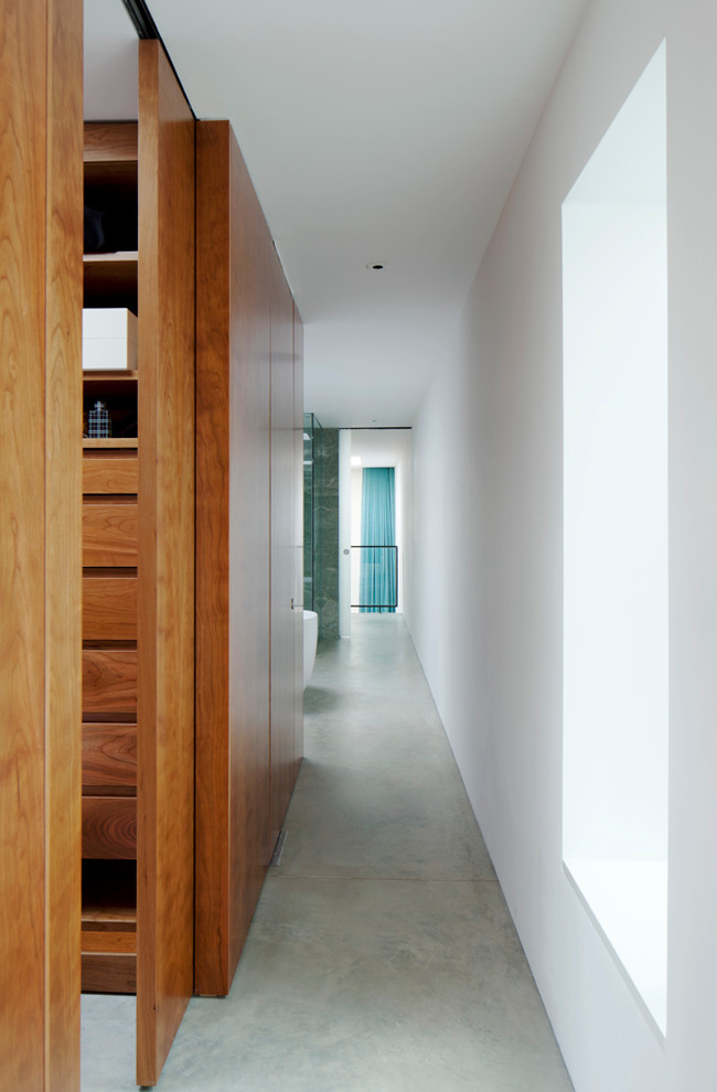 Inspiration for a contemporary hallway remodel in London with white walls