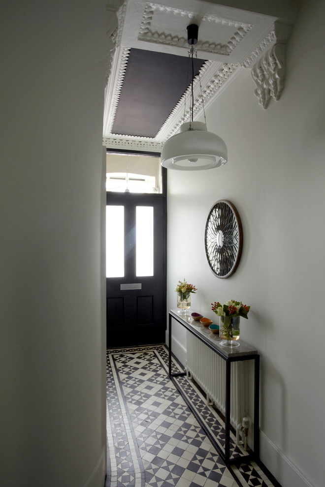 Inspiration for a victorian multicolored floor hallway remodel in London