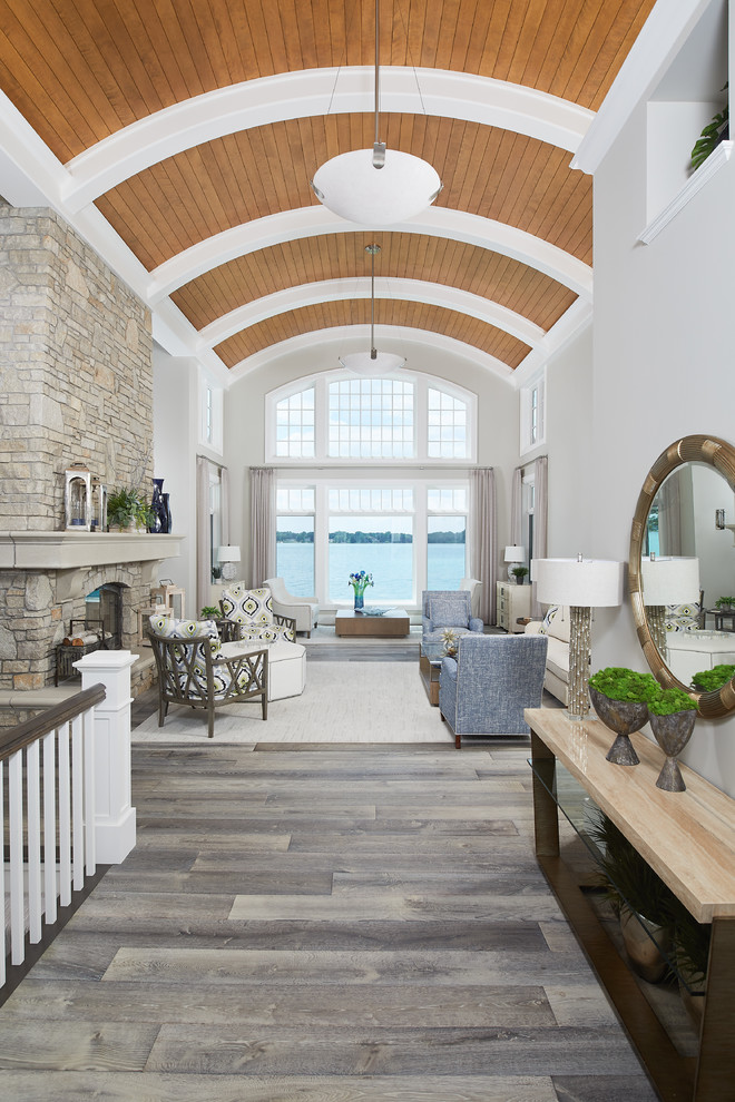 Large beach style light wood floor, gray floor and shiplap ceiling hallway photo in Grand Rapids with white walls