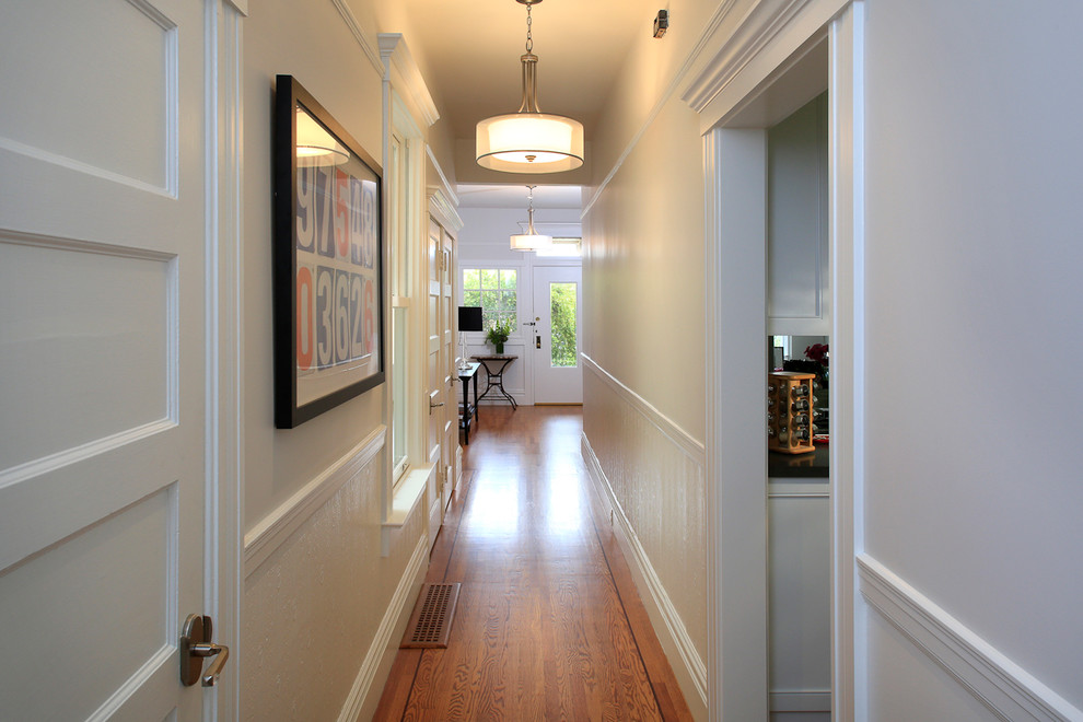Inspiration for a transitional medium tone wood floor hallway remodel in San Francisco with gray walls