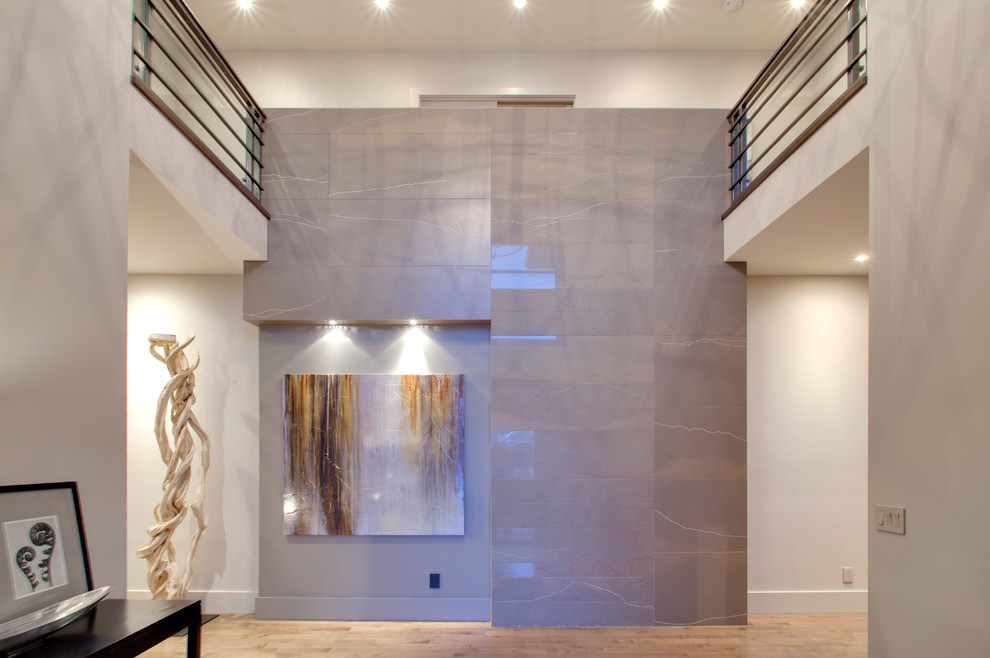 Example of a trendy medium tone wood floor hallway design in Calgary with gray walls