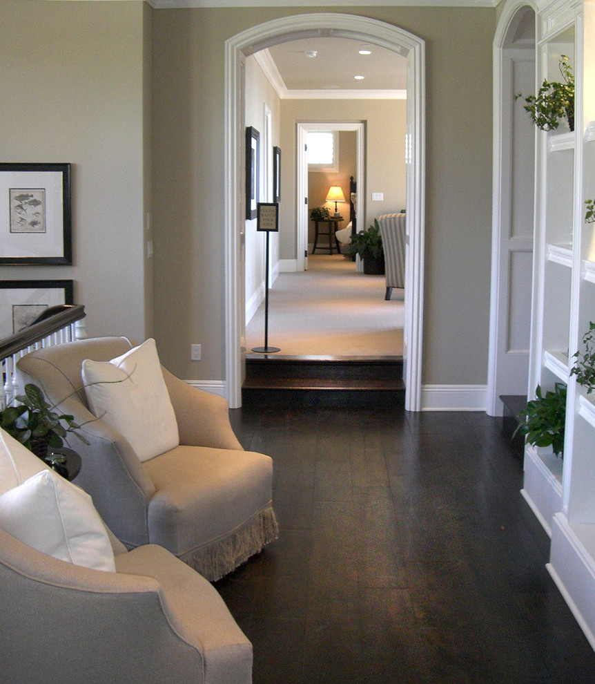 Hallway - large traditional porcelain tile hallway idea in Orange County with beige walls