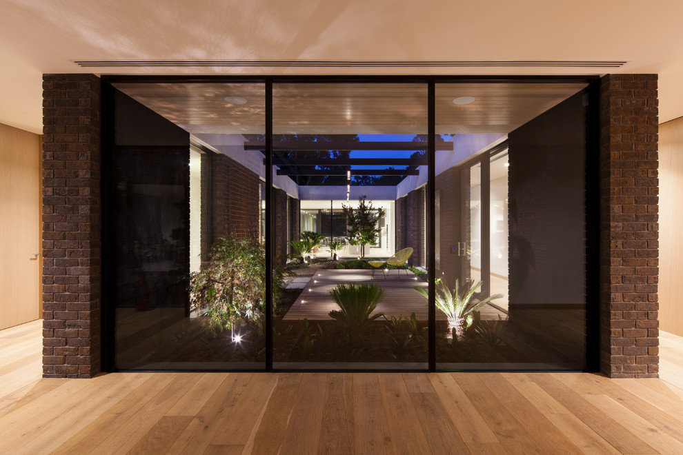 Hallway - large modern hallway idea in Melbourne